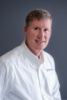 Professional photo of Tom Wills.